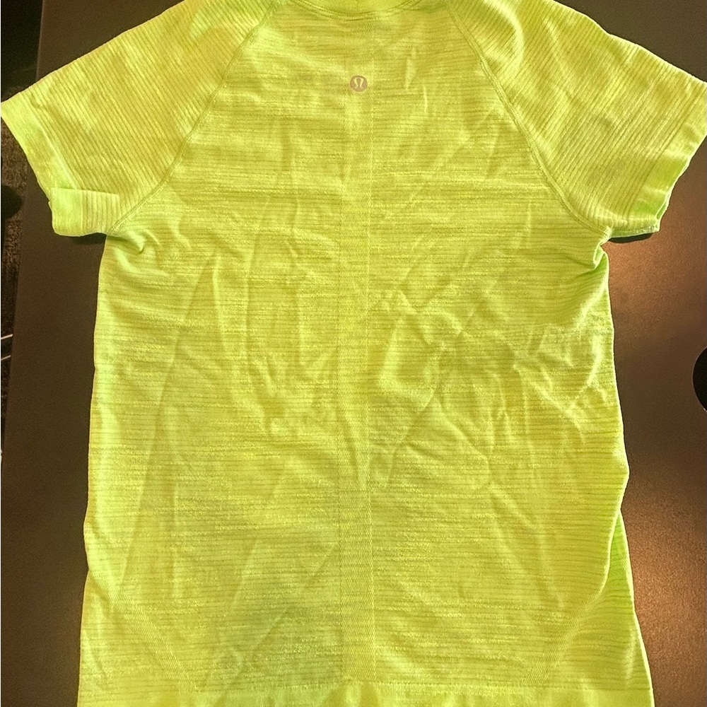 Lululemon women’s xs lime green. True color is more like the first pic.